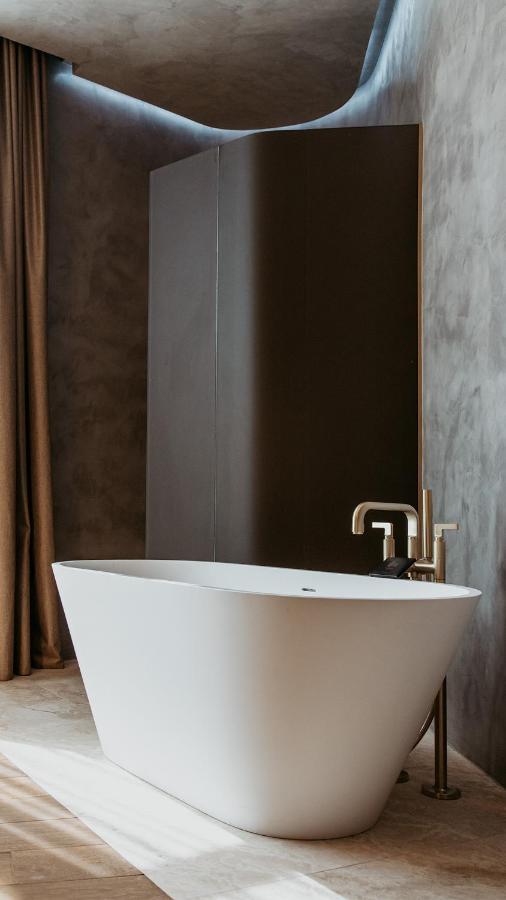 The Veil Hotel Астана Экстерьер фото A modern freestanding bathtub