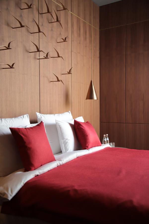 The Veil Hotel Астана Экстерьер фото A bed with cushions