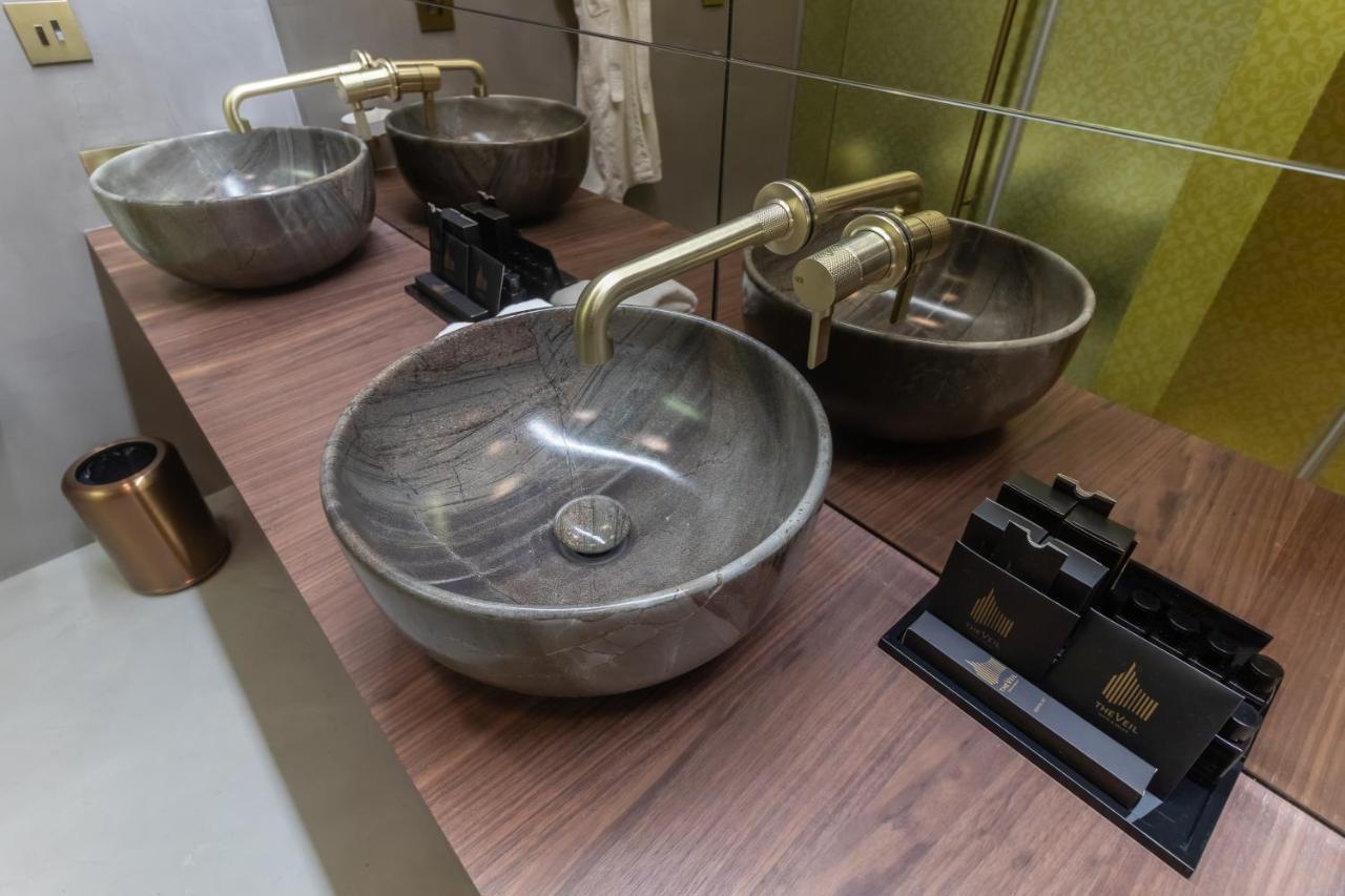 The Veil Hotel Астана Экстерьер фото Bathroom sinks