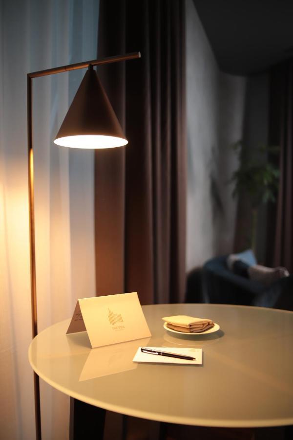 The Veil Hotel Астана Экстерьер фото A floor lamp