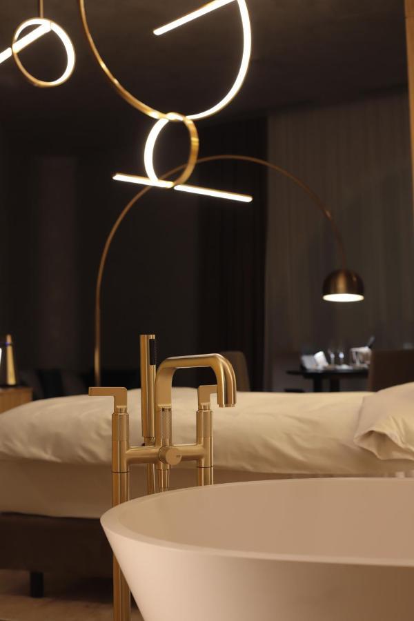 The Veil Hotel Астана Экстерьер фото A floor lamp
